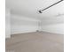 A spacious garage with ample room for parking and storage, featuring a clean and open layout at 37153 W Prado St, Maricopa, AZ 85138