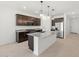 Modern kitchen featuring granite countertops, stainless steel appliances, and a kitchen island at 37153 W Prado St, Maricopa, AZ 85138