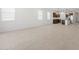 Open concept living room, dining room, and kitchen with tiled floors and stainless steel appliances at 37153 W Prado St, Maricopa, AZ 85138