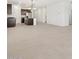 Open-concept living space featuring tile flooring, a kitchen with an island, and recessed lighting at 37153 W Prado St, Maricopa, AZ 85138