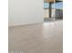 Bright living space with tile flooring and sliding glass doors to the backyard at 37153 W Prado St, Maricopa, AZ 85138