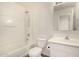 A well-lit bathroom with a tub-shower combination, toilet, and single sink vanity at 379 E Cheyenne Rd, San Tan Valley, AZ 85143