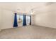 Bedroom featuring neutral carpet, ceiling fan, and large windows at 379 E Cheyenne Rd, San Tan Valley, AZ 85143