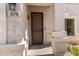 A close-up of the front door shows a decorative security door and adjacent address plate at 379 E Cheyenne Rd, San Tan Valley, AZ 85143