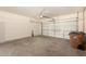 A clean two-car garage with opener, concrete floor, and plenty of space for parking and storage at 379 E Cheyenne Rd, San Tan Valley, AZ 85143