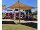 Community playground featuring varied play structures, shade structures, and common seating areas at 379 E Cheyenne Rd, San Tan Valley, AZ 85143