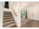 Carpeted stairs lead to the upper level with a view of the living room below at 379 E Cheyenne Rd, San Tan Valley, AZ 85143