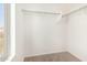 Bright walk-in closet with natural light, providing ample storage space with multiple shelves and closet rods at 379 E Cheyenne Rd, San Tan Valley, AZ 85143