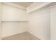 An organized, neutral walk-in closet provides ample storage space with multiple shelves and closet rods at 379 E Cheyenne Rd, San Tan Valley, AZ 85143