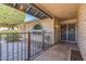 Inviting entrance with brick facade and decorative security door and block fence at 3833 W Phelps Rd, Phoenix, AZ 85053