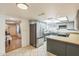 Modern kitchen with stainless steel appliances and ample counter space with bar seating at 3833 W Phelps Rd, Phoenix, AZ 85053