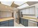 Open kitchen view showcases stainless steel appliances and seamless flow to the living areas at 3833 W Phelps Rd, Phoenix, AZ 85053