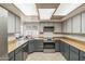 The kitchen offers ample counter space, modern appliances, and a view of the backyard swimming pool at 3833 W Phelps Rd, Phoenix, AZ 85053