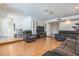 Open-concept living room with dining area, comfortable seating and laminate floors at 3833 W Phelps Rd, Phoenix, AZ 85053