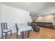 Home showcasing a dining table and a large sectional sofa in a cozy living space at 3833 W Phelps Rd, Phoenix, AZ 85053
