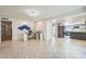 Spacious living area seamlessly connects a kitchen and home office, perfect for modern living at 3833 W Phelps Rd, Phoenix, AZ 85053