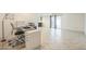 Home interior showcasing an open living area with seamless access to the adjacent office and kitchen at 3833 W Phelps Rd, Phoenix, AZ 85053
