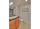 This bathroom includes a granite vanity, a toilet, and a shower with glass doors at 3935 E Rough Rider Rd # 1360, Phoenix, AZ 85050