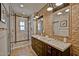 This elegant bathroom features a double sink vanity, a walk-in shower, and stylish tile accents at 3935 E Rough Rider Rd # 1360, Phoenix, AZ 85050