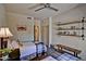 This bedroom features two twin beds, decorative shelving, and a neutral color scheme at 3935 E Rough Rider Rd # 1360, Phoenix, AZ 85050
