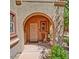 Inviting front porch featuring an arched entryway and cozy seating area at 3935 E Rough Rider Rd # 1360, Phoenix, AZ 85050