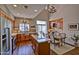 Bright kitchen features stainless appliances, a center island, wood cabinets, and is adjacent to the dining area at 3935 E Rough Rider Rd # 1360, Phoenix, AZ 85050