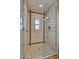 The elegant walk-in shower is tiled and features a modern glass door at 3935 E Rough Rider Rd # 1360, Phoenix, AZ 85050