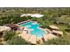 Aerial view of the community pool, featuring a hot tub and multiple seating areas with shade at 3964 E Hummingbird Ln, Phoenix, AZ 85050