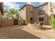 The gravel backyard has outdoor seating, a block wall, and desert landscaping that offers a serene outdoor retreat at 3964 E Hummingbird Ln, Phoenix, AZ 85050