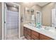 Bathroom featuring double sinks, white countertops, a large mirror and tile flooring at 3964 E Hummingbird Ln, Phoenix, AZ 85050