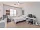Bright bedroom featuring neutral paint, a ceiling fan, and a writing desk at 3964 E Hummingbird Ln, Phoenix, AZ 85050