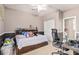 Bedroom featuring two-toned paint, carpeted floors, and a writing desk at 3964 E Hummingbird Ln, Phoenix, AZ 85050