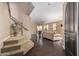 Open-concept living room and dining area with hardwood floors and staircase, perfect for entertaining at 3964 E Hummingbird Ln, Phoenix, AZ 85050