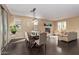 Bright living area with hardwood floors, a fireplace, a dining area, and cozy seating for relaxation and entertaining at 3964 E Hummingbird Ln, Phoenix, AZ 85050