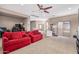 Living room with a ceiling fan, furniture, natural light, and carpet at 3964 E Hummingbird Ln, Phoenix, AZ 85050