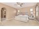 Cozy main bedroom featuring carpeted floors, neutral paint and abundant natural light at 3964 E Hummingbird Ln, Phoenix, AZ 85050