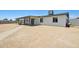 Exterior view of a home with a large, low-maintenance backyard and covered patio for relaxation at 4117 W Camino Acequia Ave, Phoenix, AZ 85051