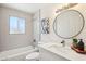 Updated bathroom featuring subway tile, modern vanity and stylish decor with plenty of natural light at 4117 W Camino Acequia Ave, Phoenix, AZ 85051