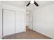 Bedroom featuring wood floors, a closet, and a neutral color scheme at 4117 W Camino Acequia Ave, Phoenix, AZ 85051