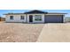Charming single-story home with a neatly landscaped front yard and an attached garage at 4117 W Camino Acequia Ave, Phoenix, AZ 85051
