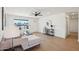 Bright living room with hardwood floors, neutral decor, a ceiling fan, and an entry door view at 4117 W Camino Acequia Ave, Phoenix, AZ 85051