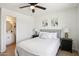 Comfortable main bedroom with ensuite bathroom, wood floors, and soft lighting at 4117 W Camino Acequia Ave, Phoenix, AZ 85051