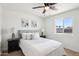 Cozy main bedroom featuring neutral decor, wood floors, and bedside lamps at 4117 W Camino Acequia Ave, Phoenix, AZ 85051