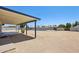Covered patio area leading to a spacious backyard, perfect for outdoor entertaining and relaxation at 4117 W Camino Acequia Ave, Phoenix, AZ 85051