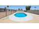A sparkling pool with a white concrete border offers a private and inviting backyard oasis at 4117 W Camino Acequia Ave, Phoenix, AZ 85051
