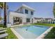 Backyard with a pool, outdoor kitchen, dining area, and modern architectural design at 4120 N 44Th Pl, Phoenix, AZ 85018