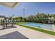 Backyard pool surrounded by lush greenery, pavers, and a dining table with seating at 4120 N 44Th Pl, Phoenix, AZ 85018