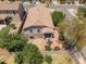 Aerial view showcasing the home, landscaped backyard, covered patio, and community at 4553 W Kirkland Ave, San Tan Valley, AZ 85144