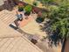 High angle view features a patio with a firepit, xeriscaped backyard, and covered outdoor seating at 4553 W Kirkland Ave, San Tan Valley, AZ 85144
