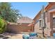 Beautifully landscaped backyard with drought tolerant features, brick patio, and covered space at 4553 W Kirkland Ave, San Tan Valley, AZ 85144